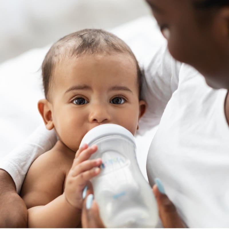 A baby feeding contentedly